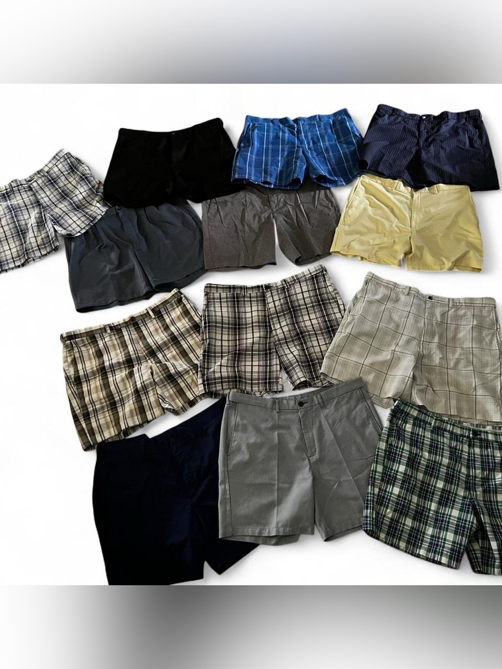 13 pairs of Golf shorts in various colors and patterns including plaid and solid